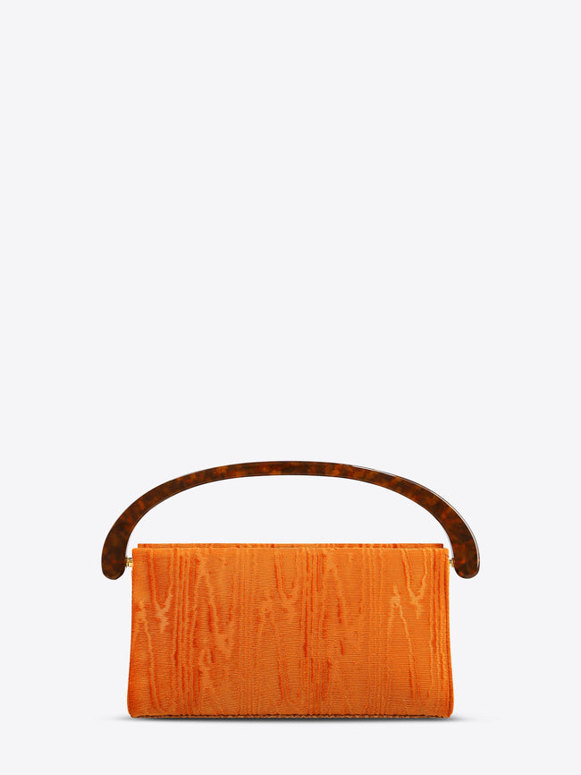 Orange clutch bag with brown handle on a white background
