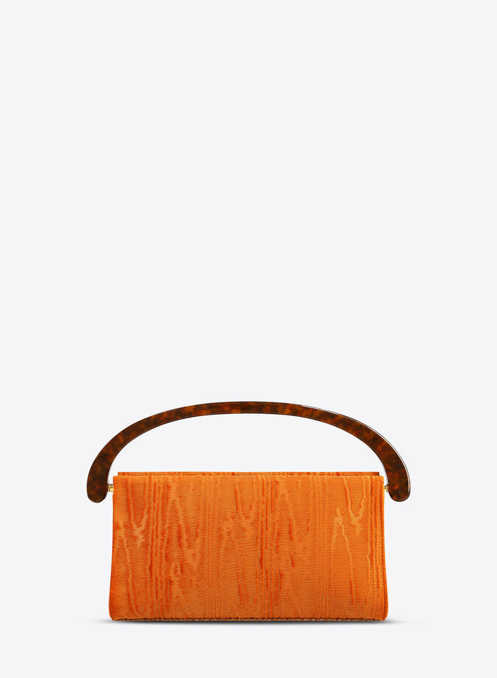 Orange clutch bag with brown handle on a white background