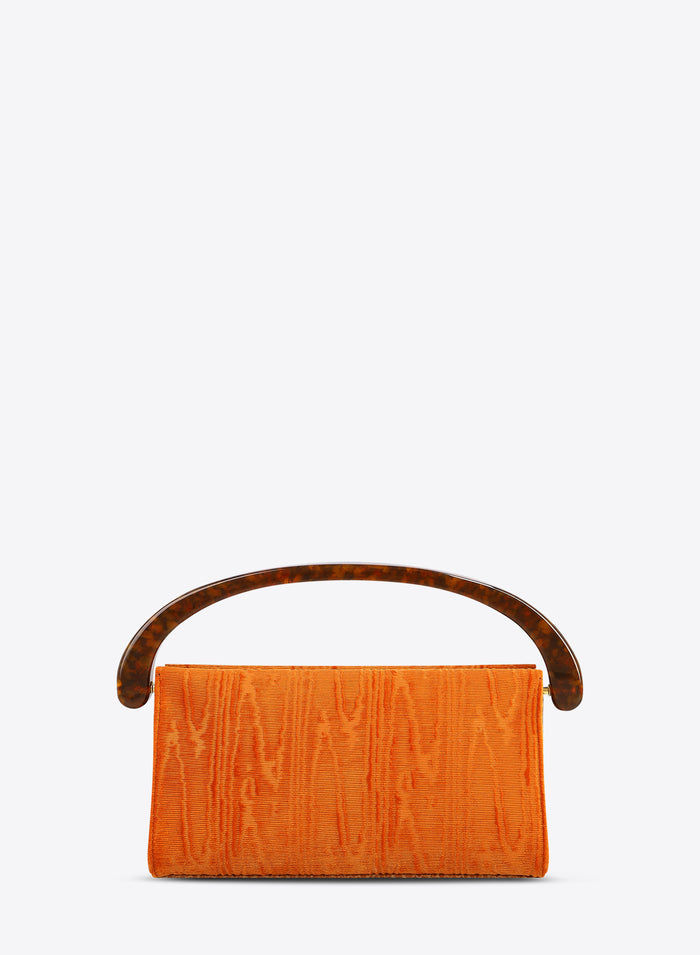 Orange handbag with wooden handle on a white background
