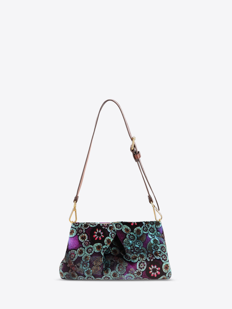 Multicolored patterned handbag with a strap on a white background