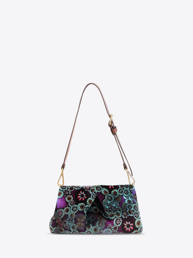 Multicolored patterned handbag with a strap on a white background