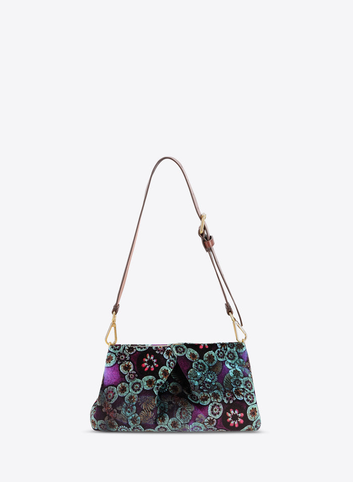 Multicolored patterned handbag with a strap on a white background