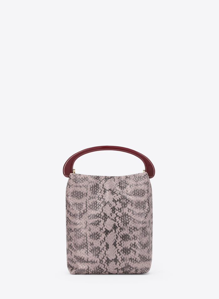 Small handbag with snake print and burgundy handle on a white background