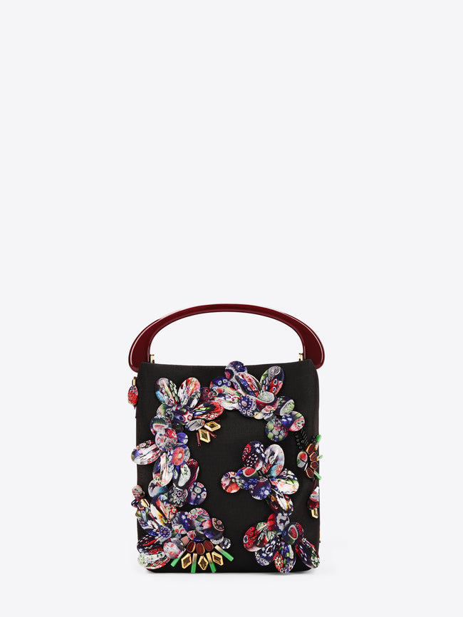 Black handbag with colorful floral embroidery on a white background