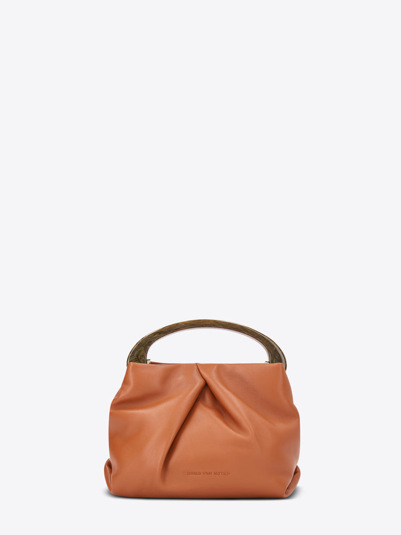 Orange leather handbag on a white background