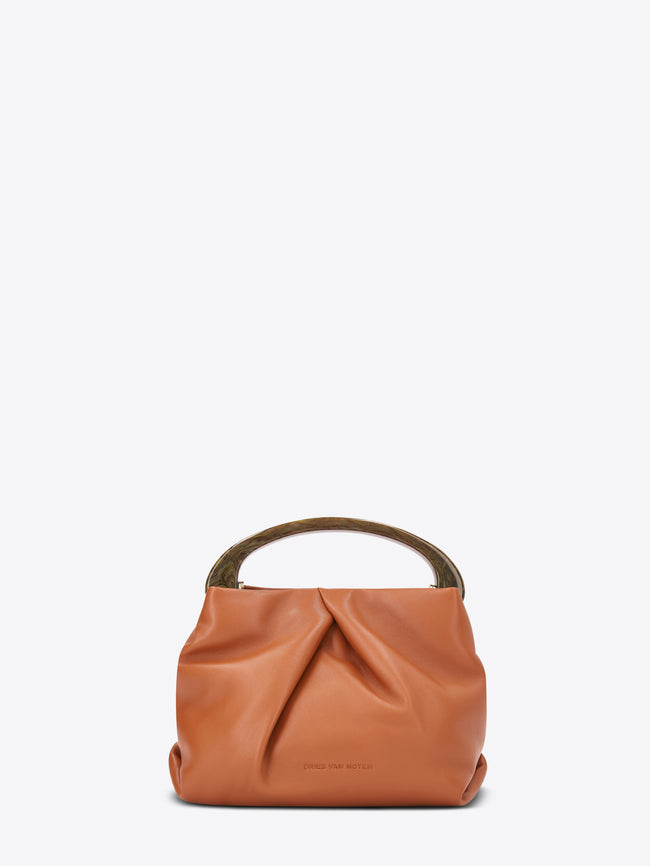 Orange leather handbag on a white background