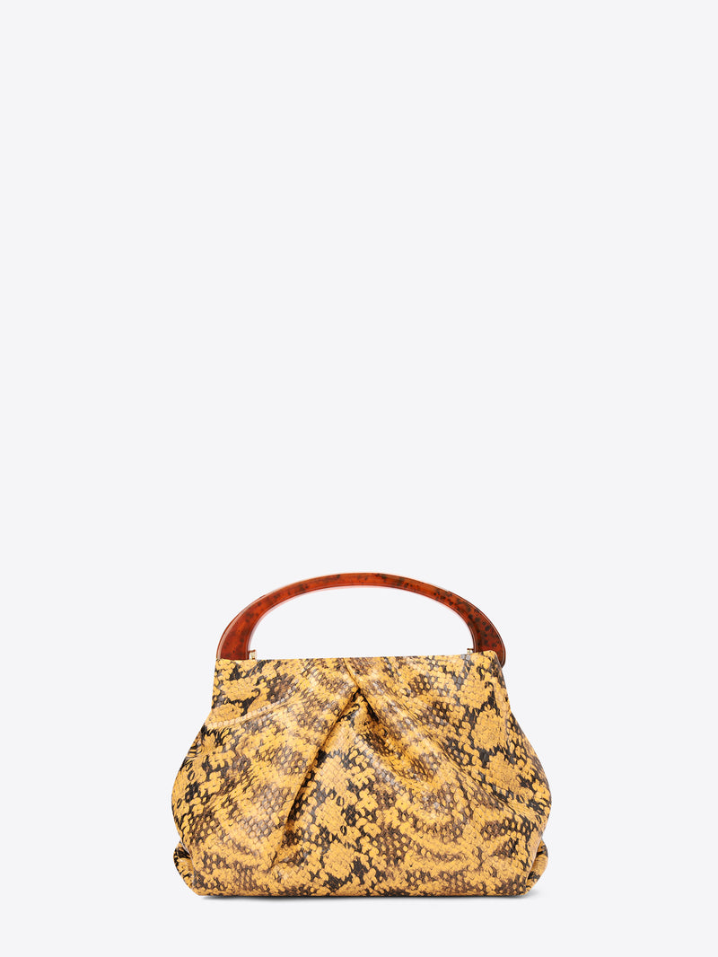 Yellow patterned handbag with a brown handle on a white background