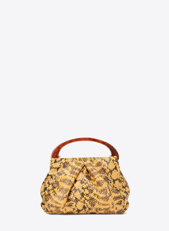 Yellow patterned handbag with a brown handle on a white background