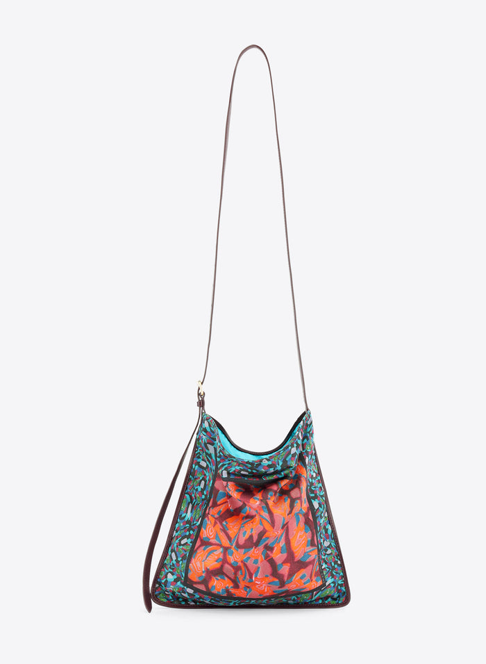 Multicolored patterned handbag with a strap on a white background