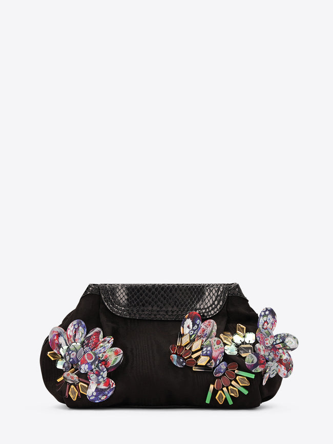Black clutch bag with floral embellishments on a white background