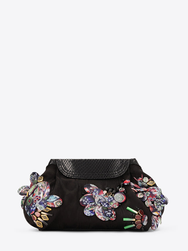 Black handbag with colorful floral embellishments on a white background