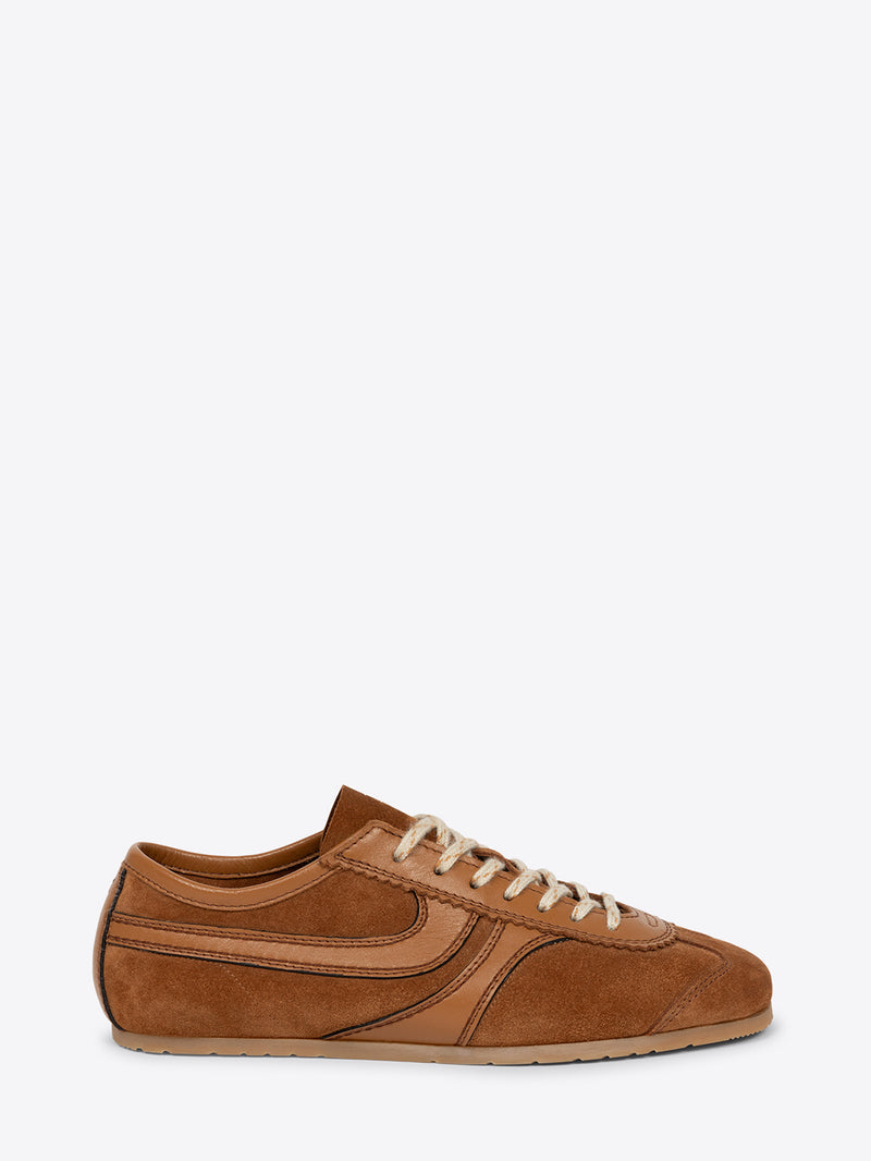 Brown suede sneaker on a white background