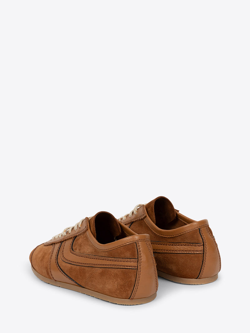 Pair of brown sneakers on a white background