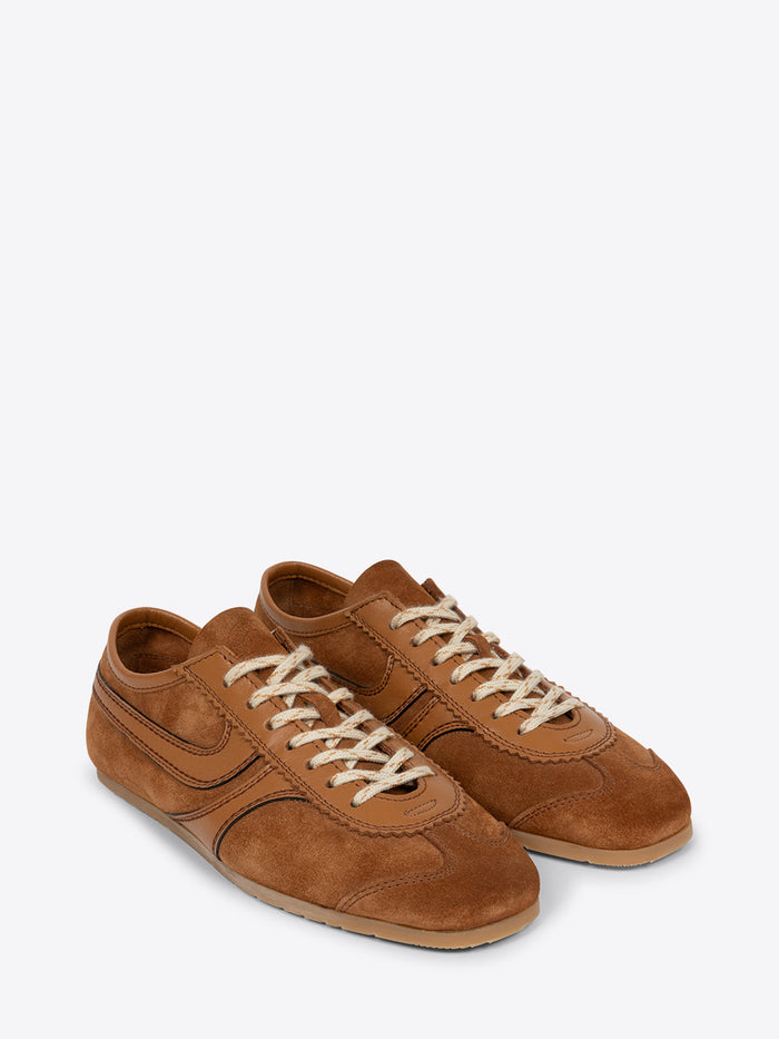 Pair of brown suede shoes on a white background