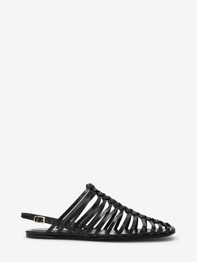 Black sandal with strappy design on a white background