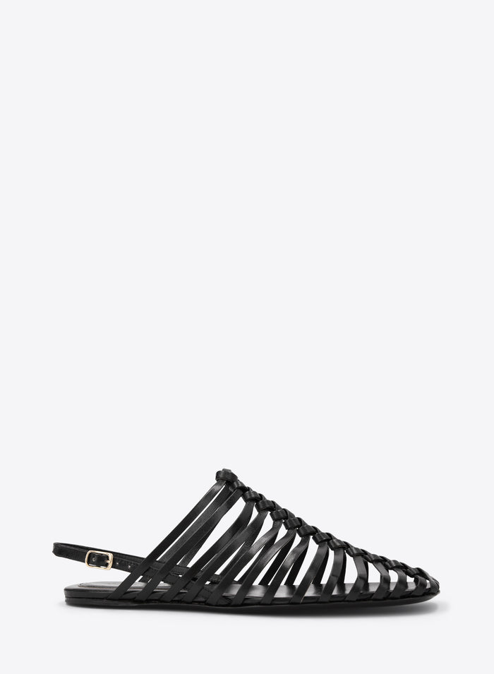 Black sandal with strappy design on a white background