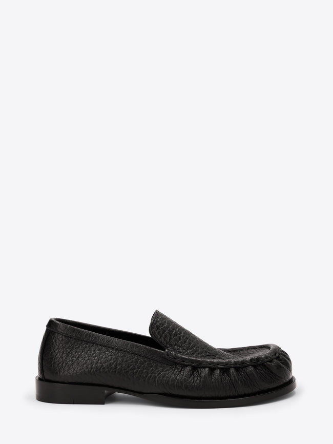 Black loafer shoe on a white background