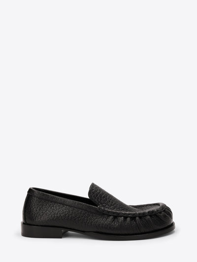 Black loafer shoe on a white background