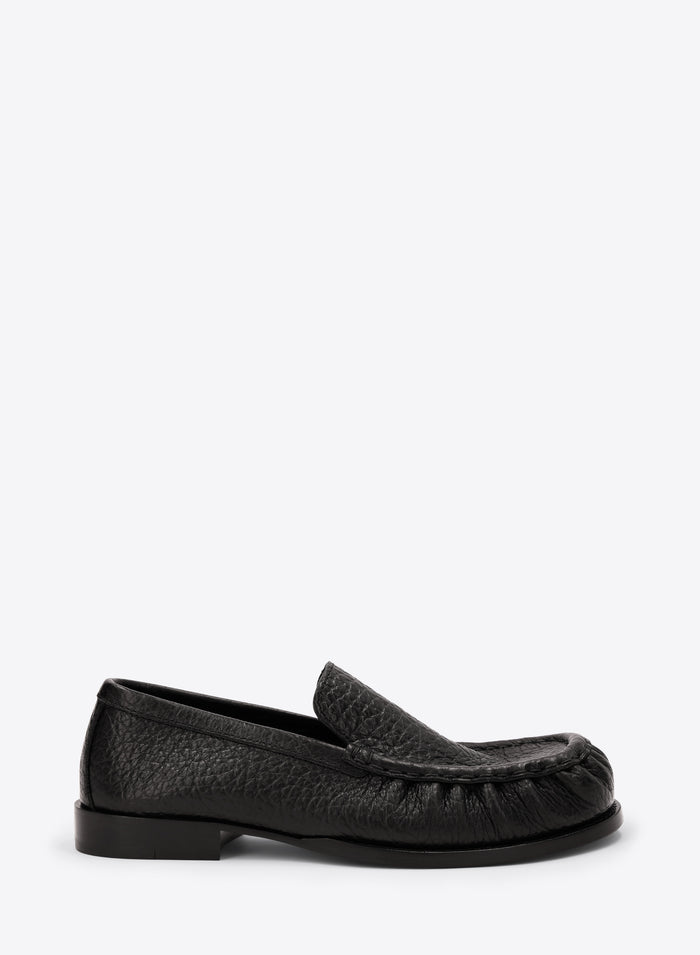 Black loafer shoe on a white background