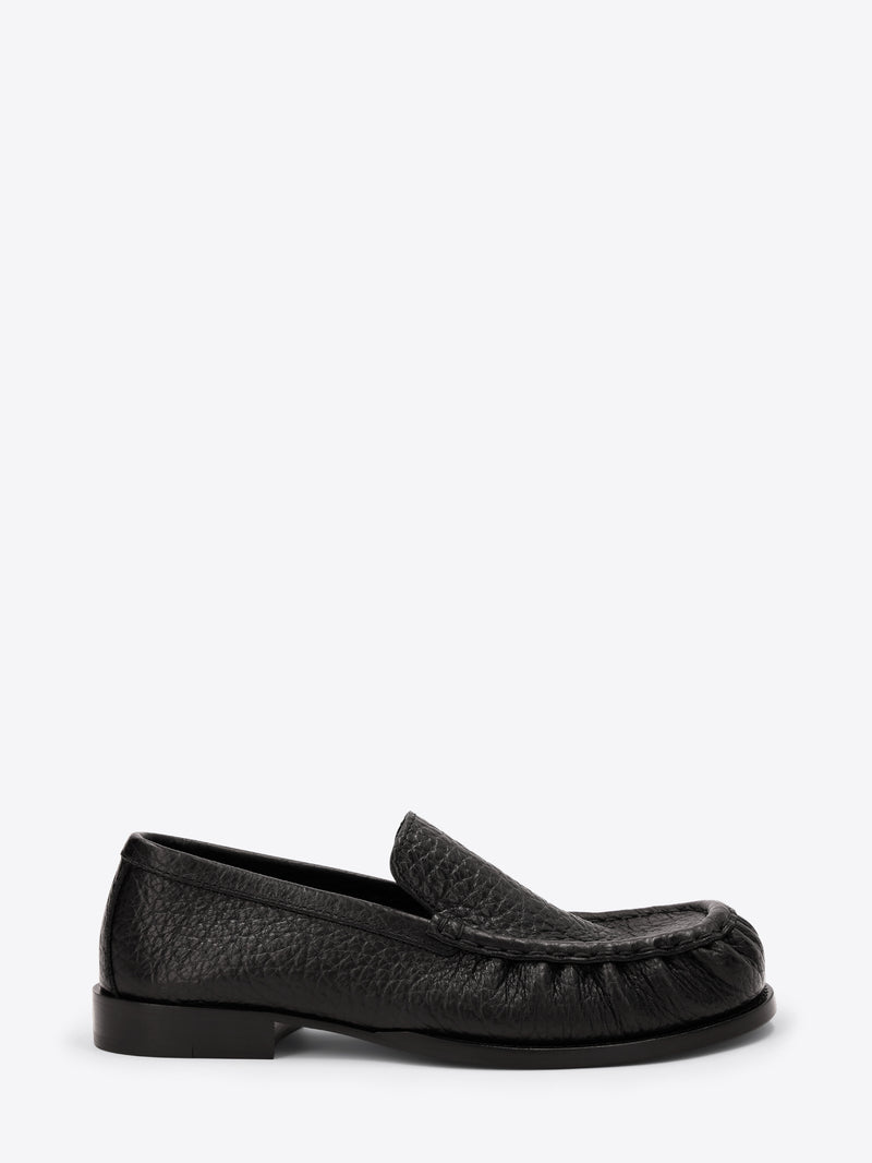 Black loafer shoe on a white background