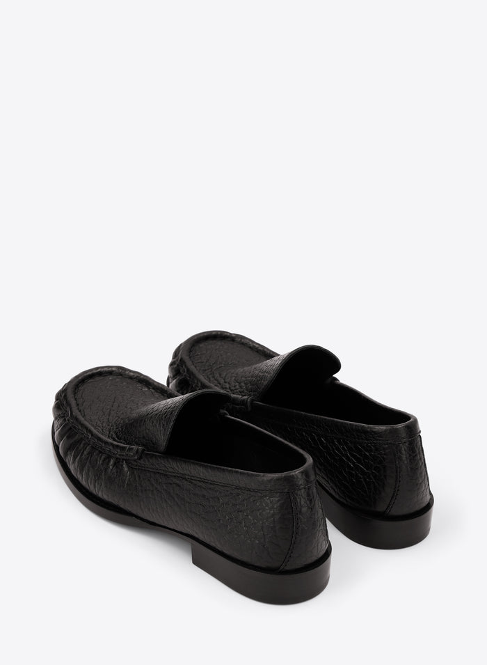 Pair of black loafers on a white background