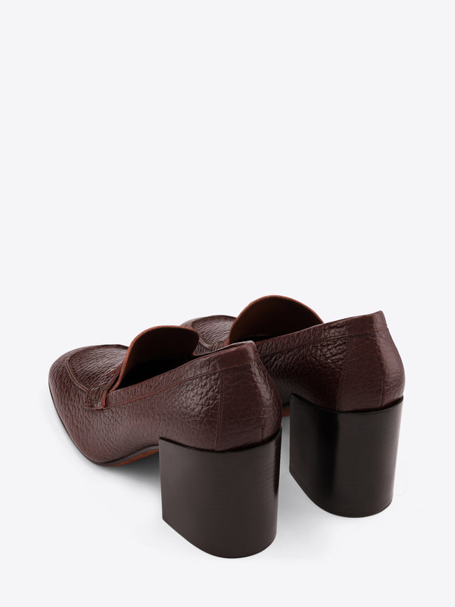 Brown leather shoes with block heels on a white background