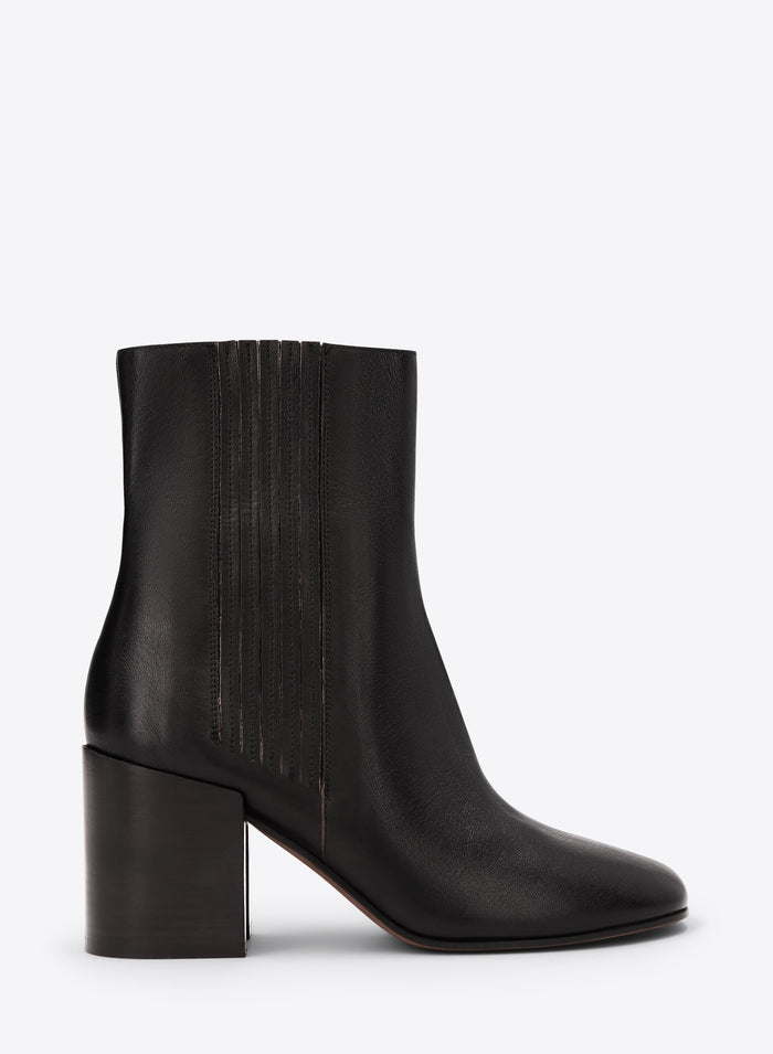 Black ankle boot on a white background