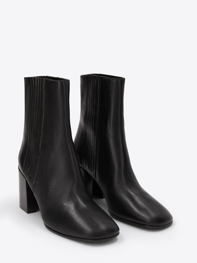 Pair of black ankle boots on a white background