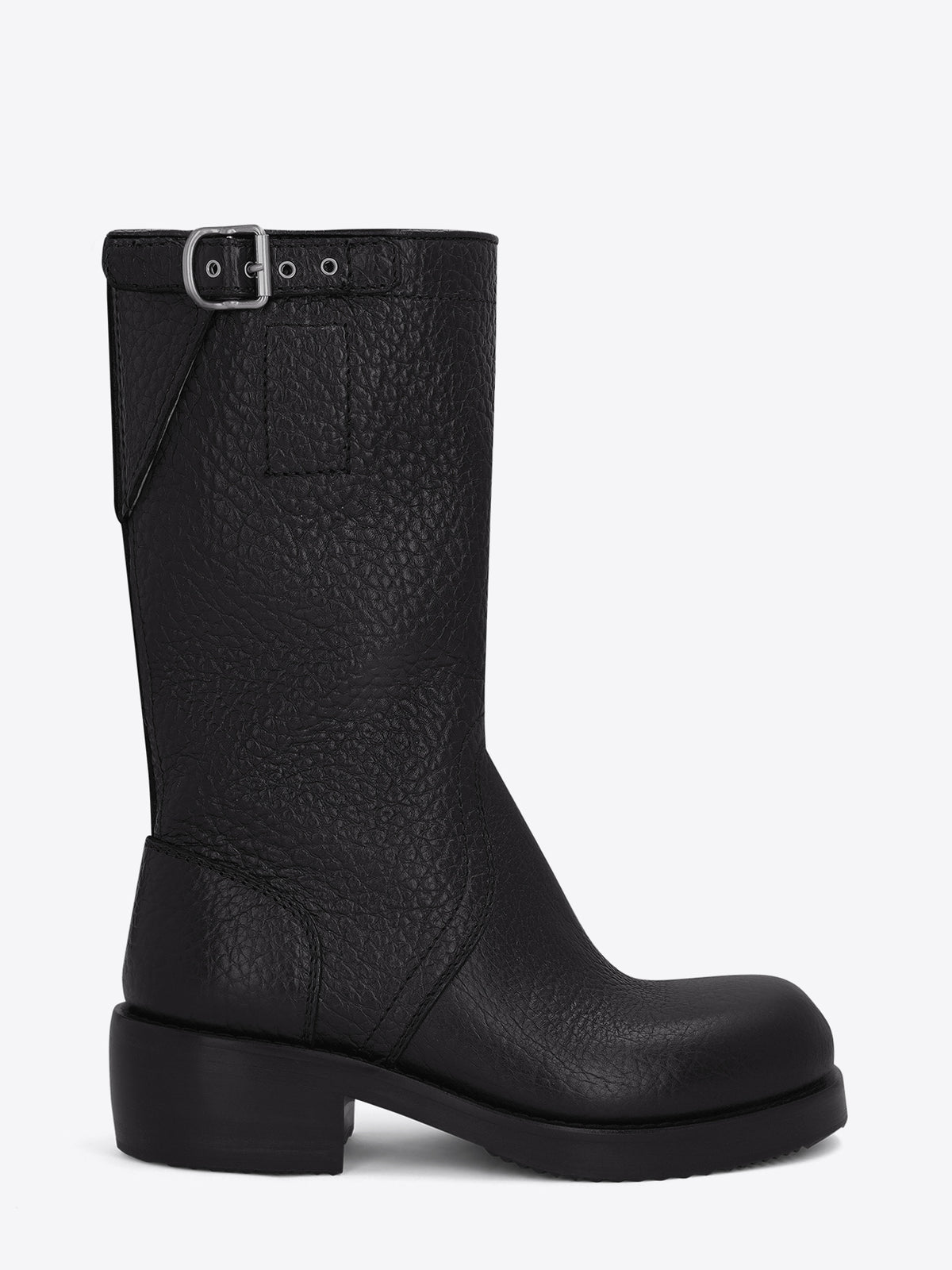 Pair of black leather boots on a light grey background