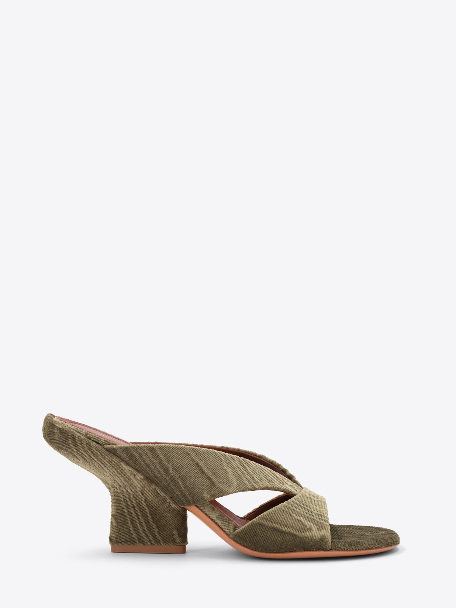 Green mule shoe with a block heel on a white background