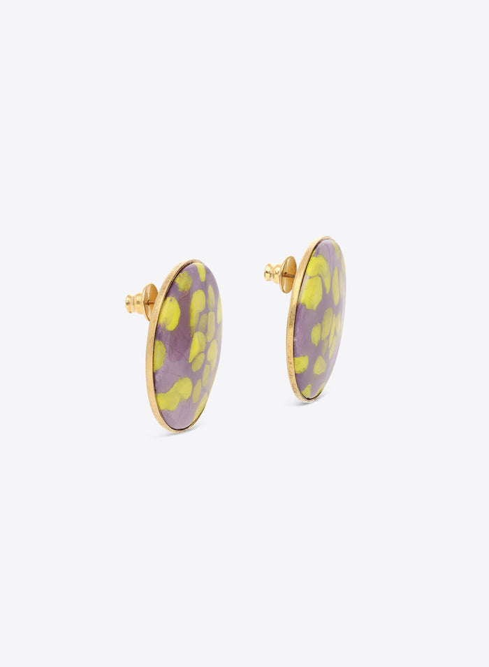 Pair of round earrings with purple and yellow floral pattern on a white background
