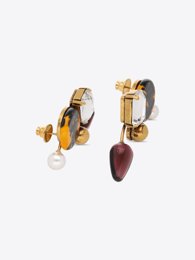 Pair of earrings with colorful gemstones on a white background