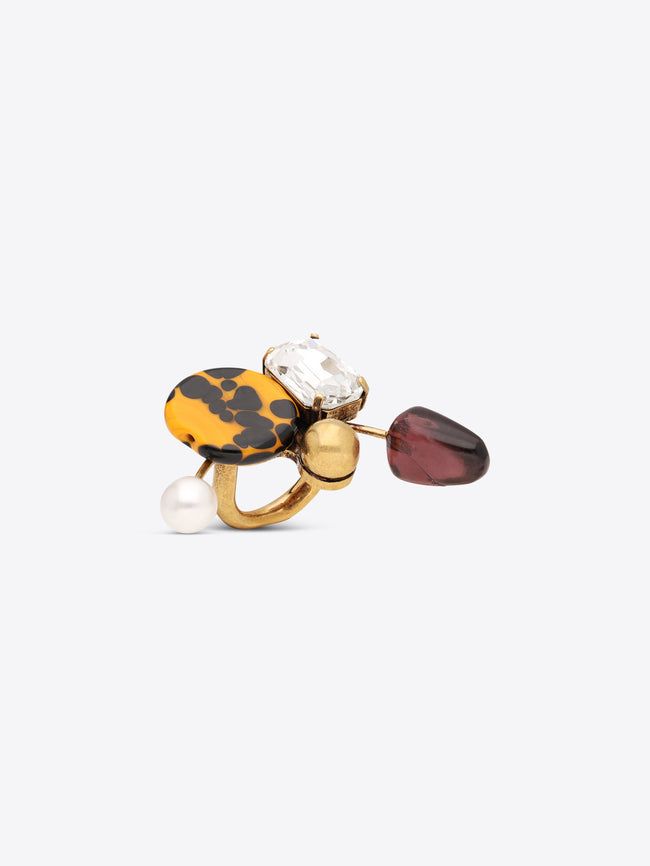 Statement ring with a yellow patterned accent, faceted purple gemstone, clear crystal detail and pearl embellishment 