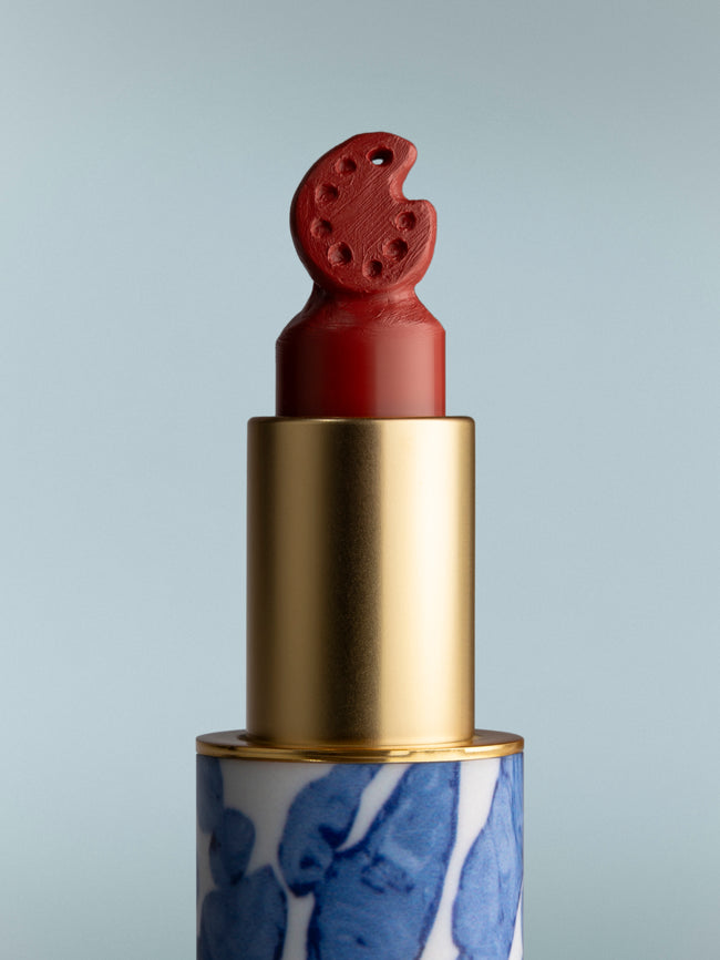 Lipstick with a unique design on a gray background