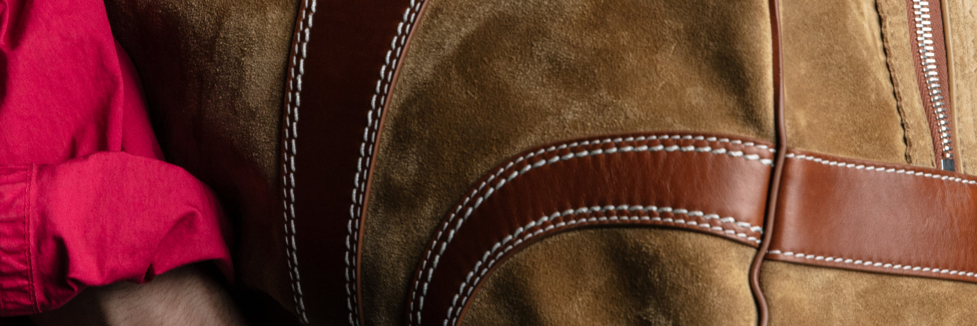 Close-up of a brown leather product with stitching detail - Dries Van Noten