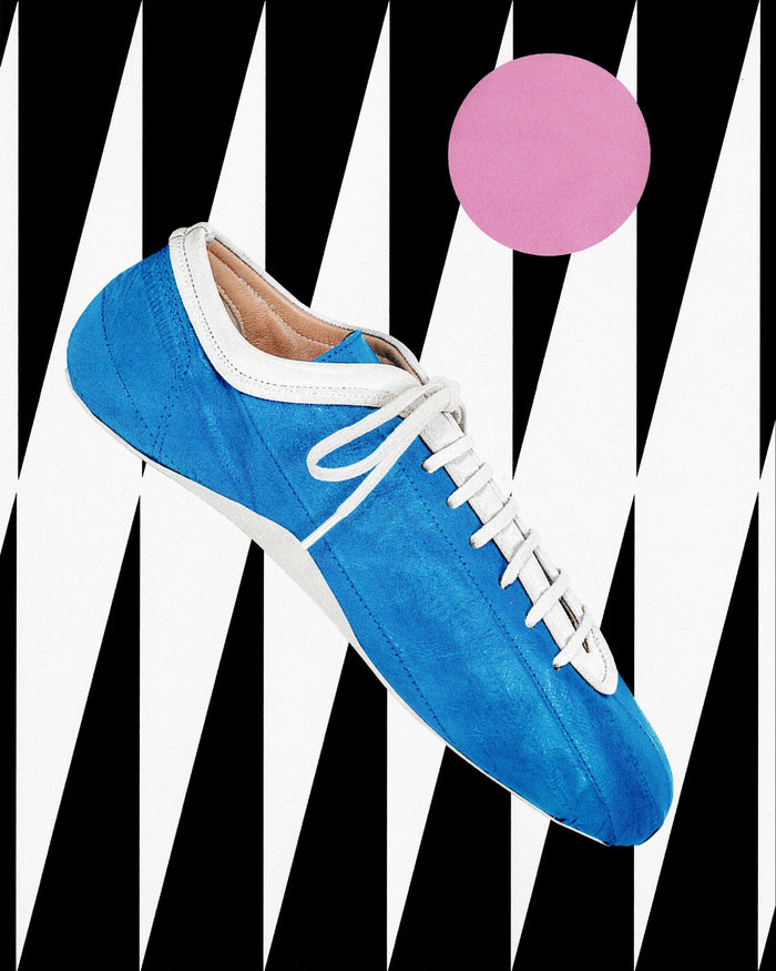 Blue sneaker with white laces on a graphic black and white background 