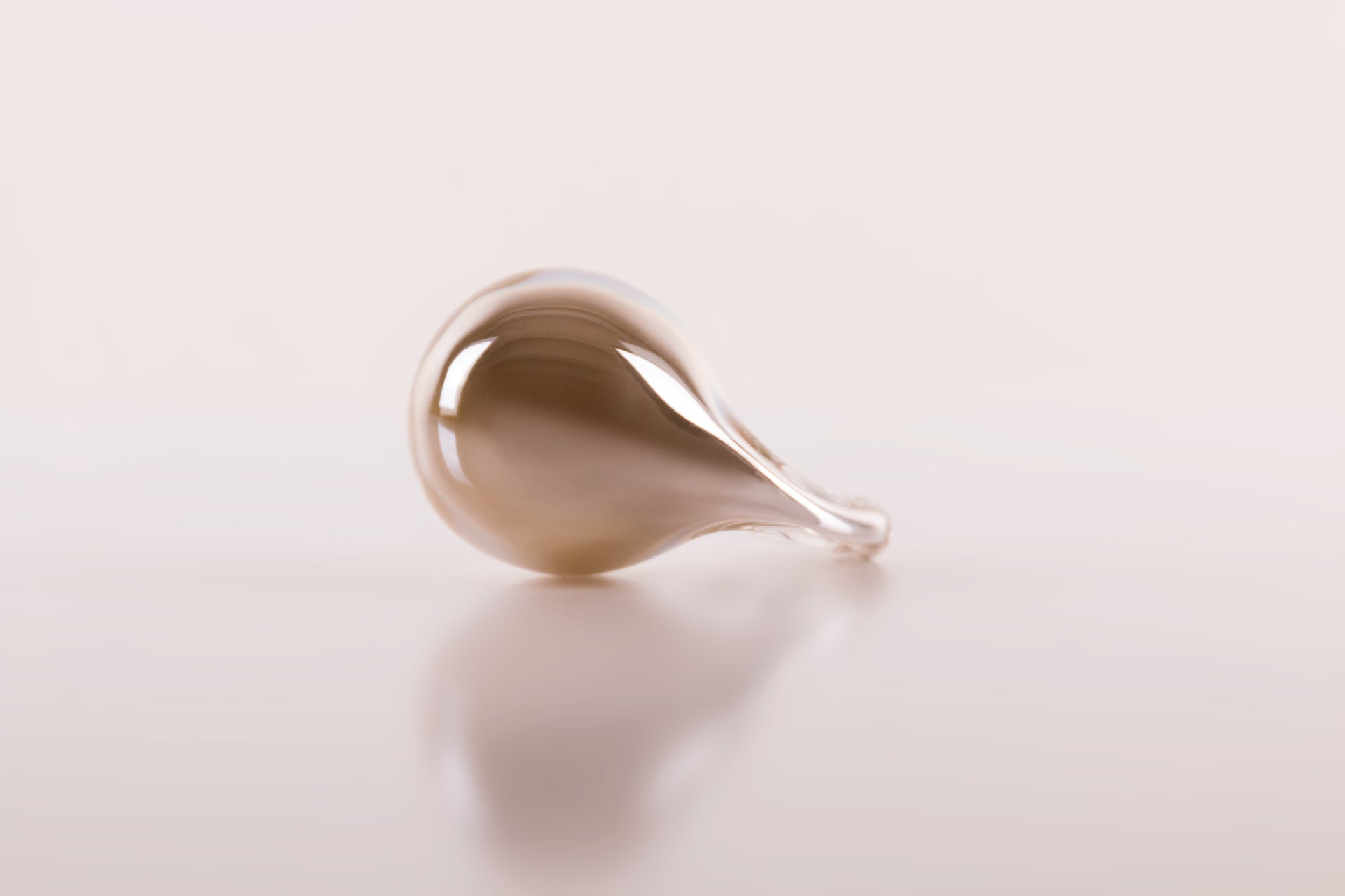 Close-up of a teardrop-shaped object on a white background