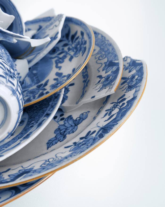 Blue and white ceramic tableware set on a white background - Dries Van Noten