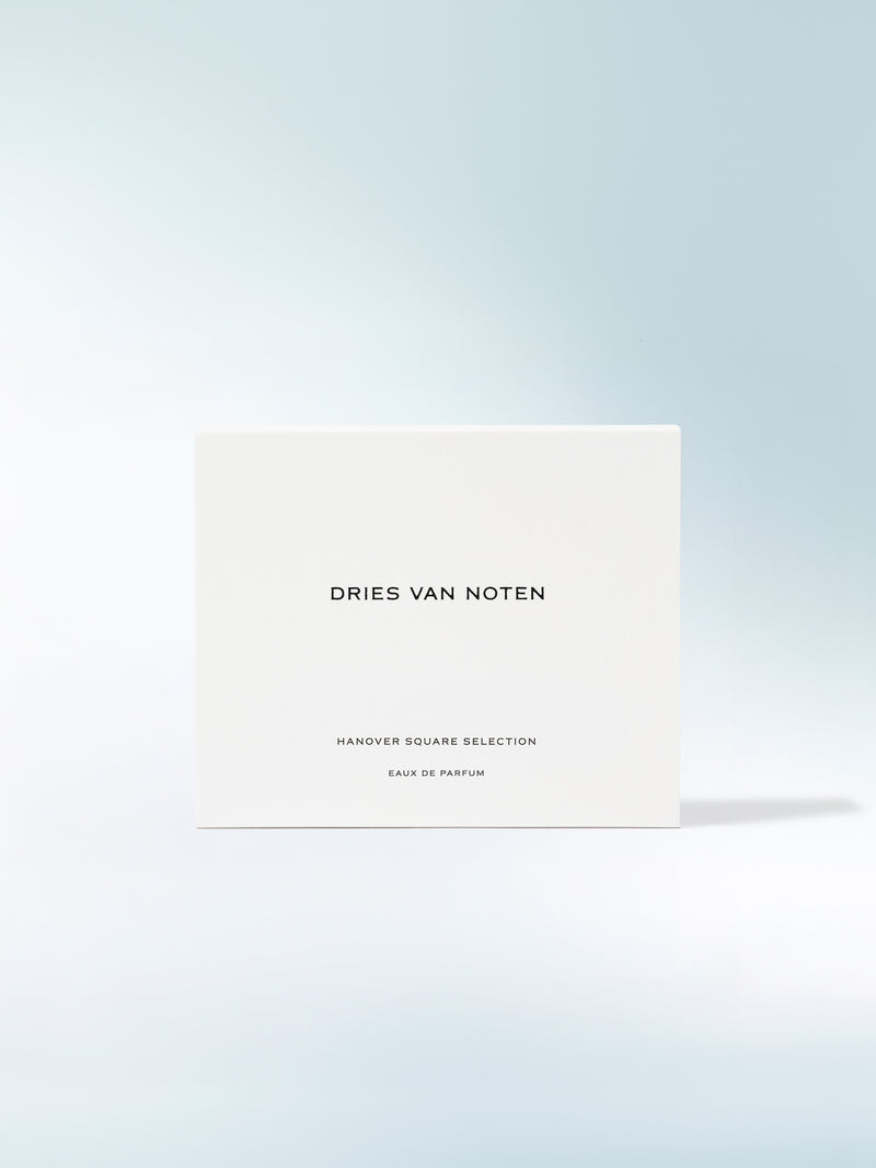 Dries Van Noten perfume box on a light blue gradient background