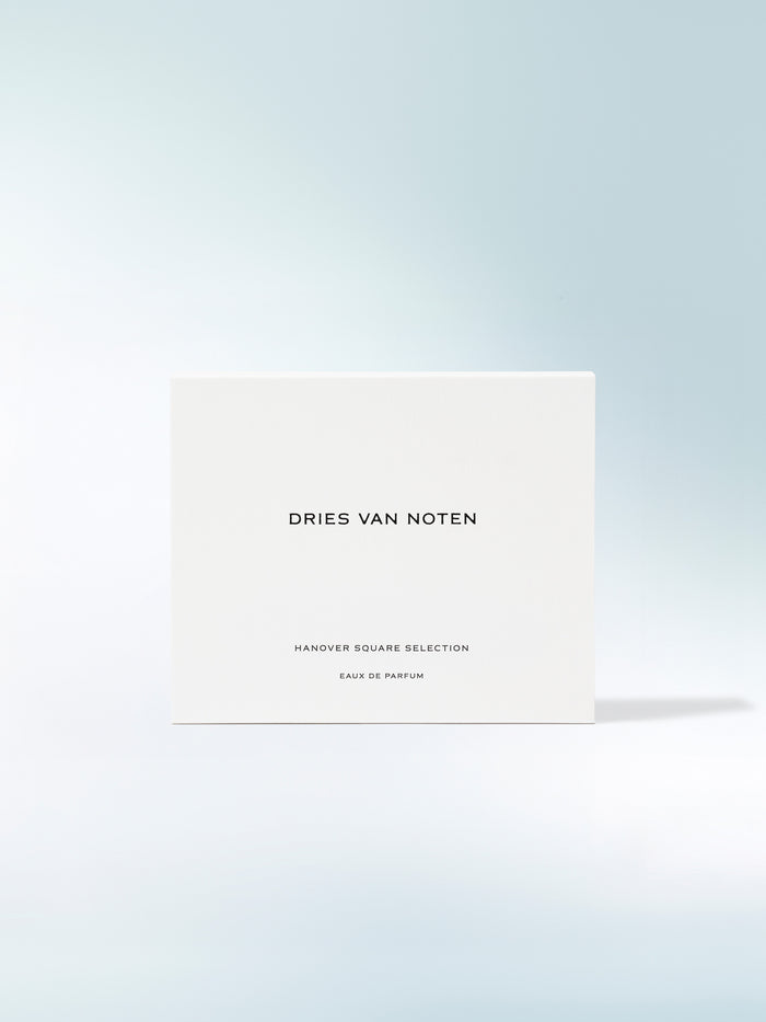 Dries Van Noten perfume box on a light blue gradient background