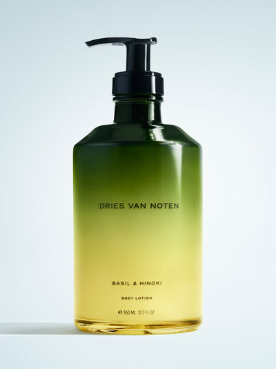 Dries Van Noten body lotion bottle on a light gray background