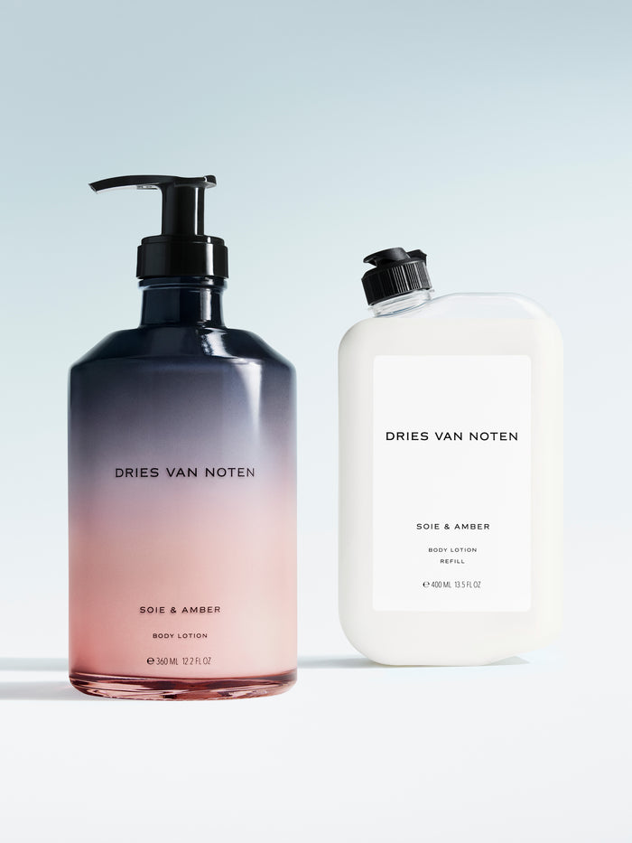 Dries Van Noten body lotion in a gradient glass pump bottle displayed next to its matching refill container 