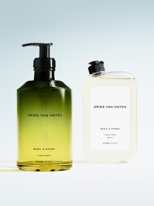 Dries Van Noten liquid soap in a gradient glass pump bottle displayed next to its matching refill container 