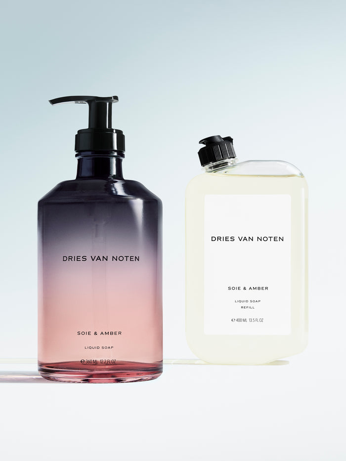 Dries Van Noten liquid soap in a gradient glass pump bottle displayed next to its matching refill container 