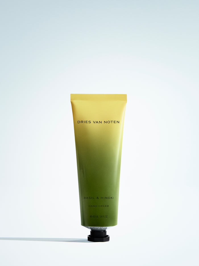 Gradient hand cream tube with 'Dries Van Noten' branding on a light gray background