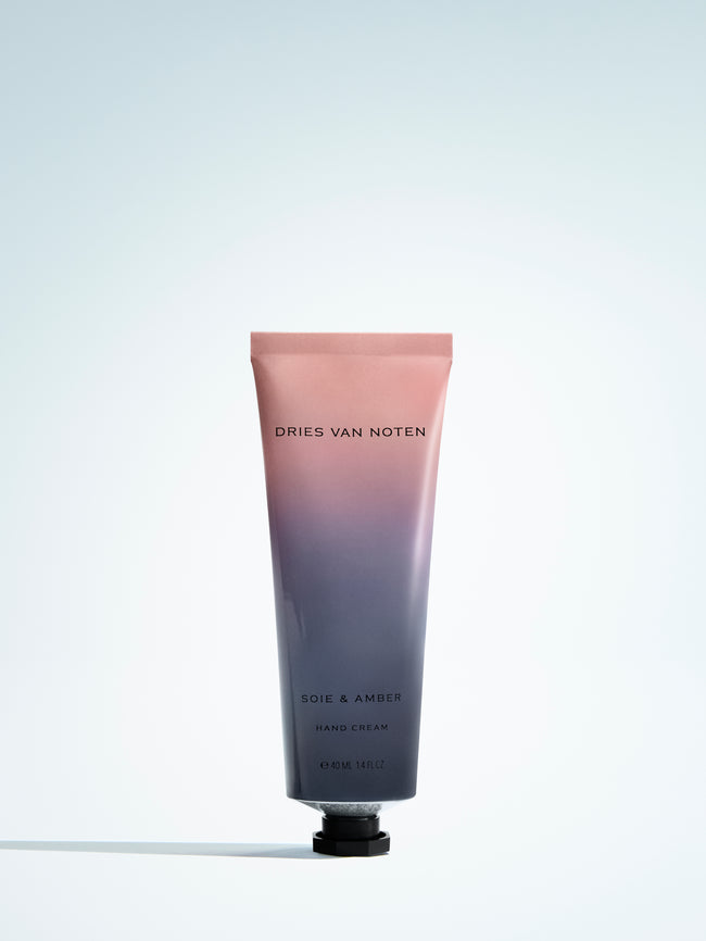 Gradient hand cream tube with 'Dries Van Noten' branding on a light gray background