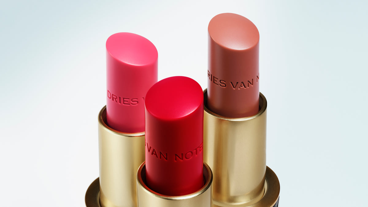 Set of three lip balm bullets on a white background