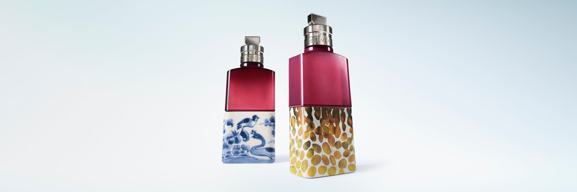 Two fragrance bottles, one featuring a blue and white wave pattern base and the other a textured gold base, set against a light blue gradient background.