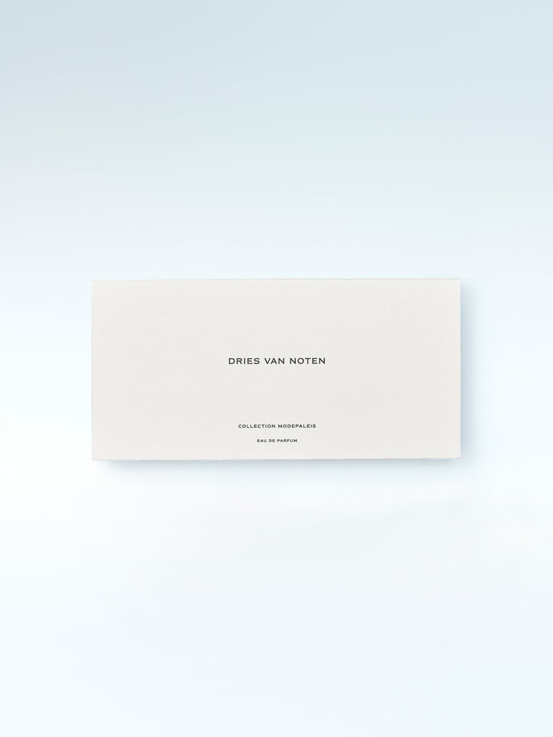 Dries Van Noten perfume packaging on a light gray background