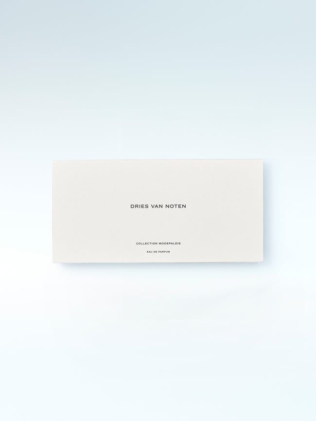 Dries Van Noten perfume packaging on a light gray background